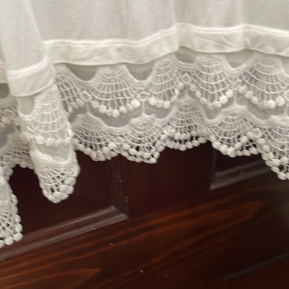 Beautiful white blouse. I am 5’9” and it reaches to mid thigh. Never worn. - Picture 2 of 4